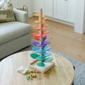 Cute wooden Montessori Rainbow tower toy with multicolor flowers and balls.