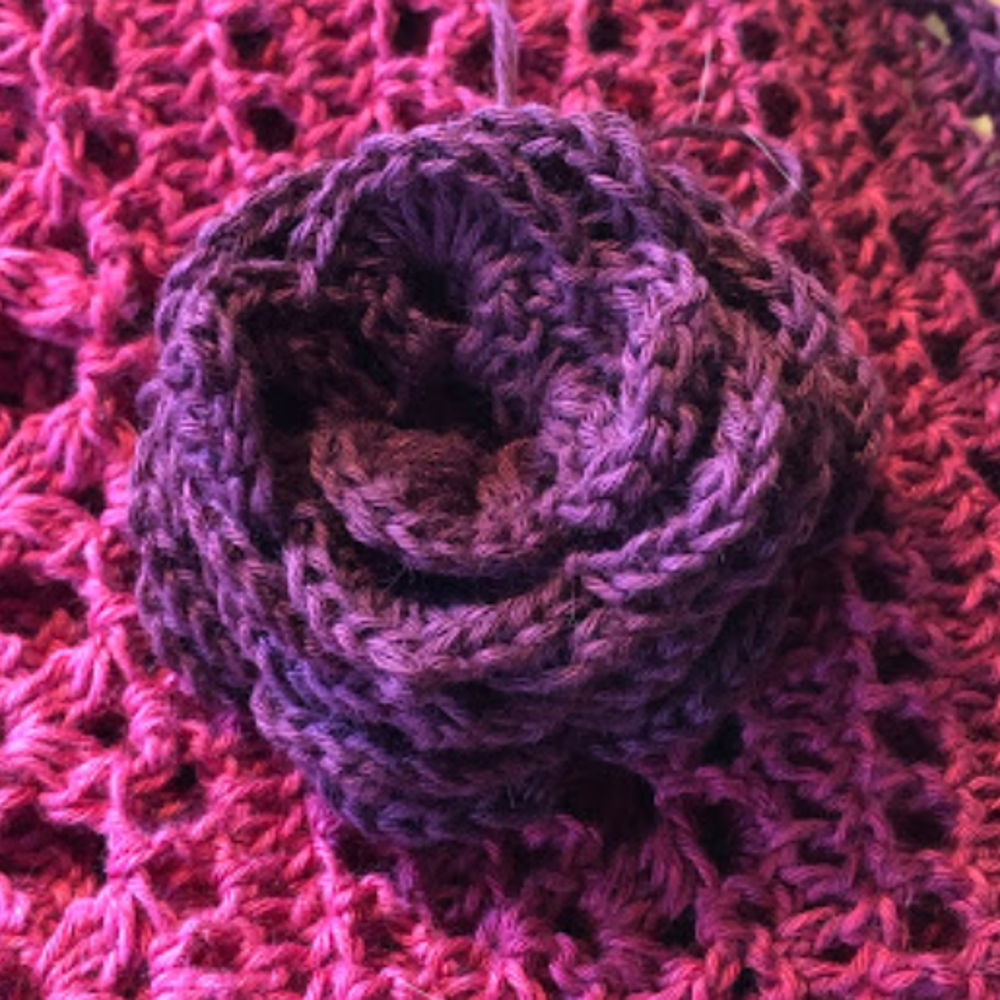 Crochet a simple rose with leftover Scheepjes Whirl yarn.
