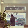 Dom the sign painter is painting the window