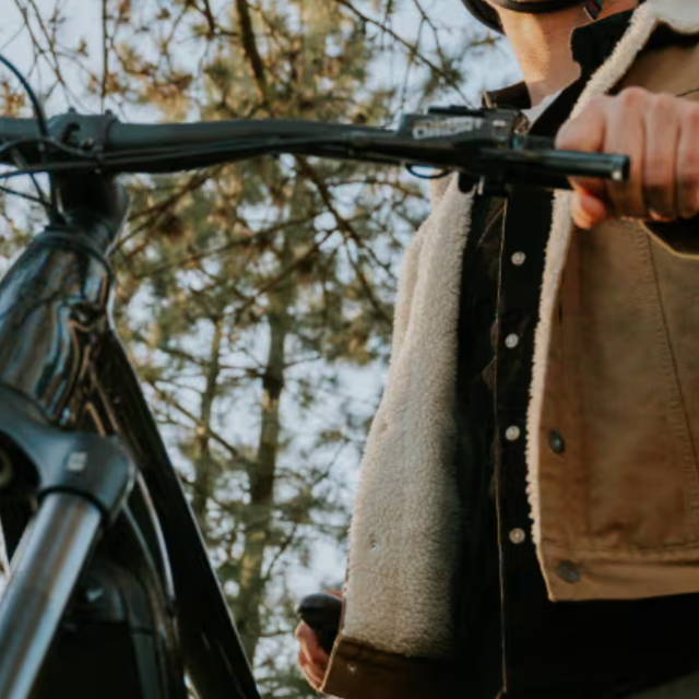 Rider with Giant electric bike under trees