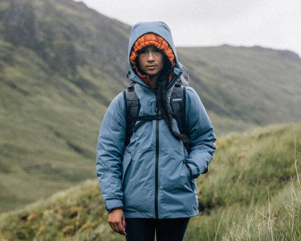 Steph Rogers from Finisterre wearing recycled waterproof jacket in the highlands