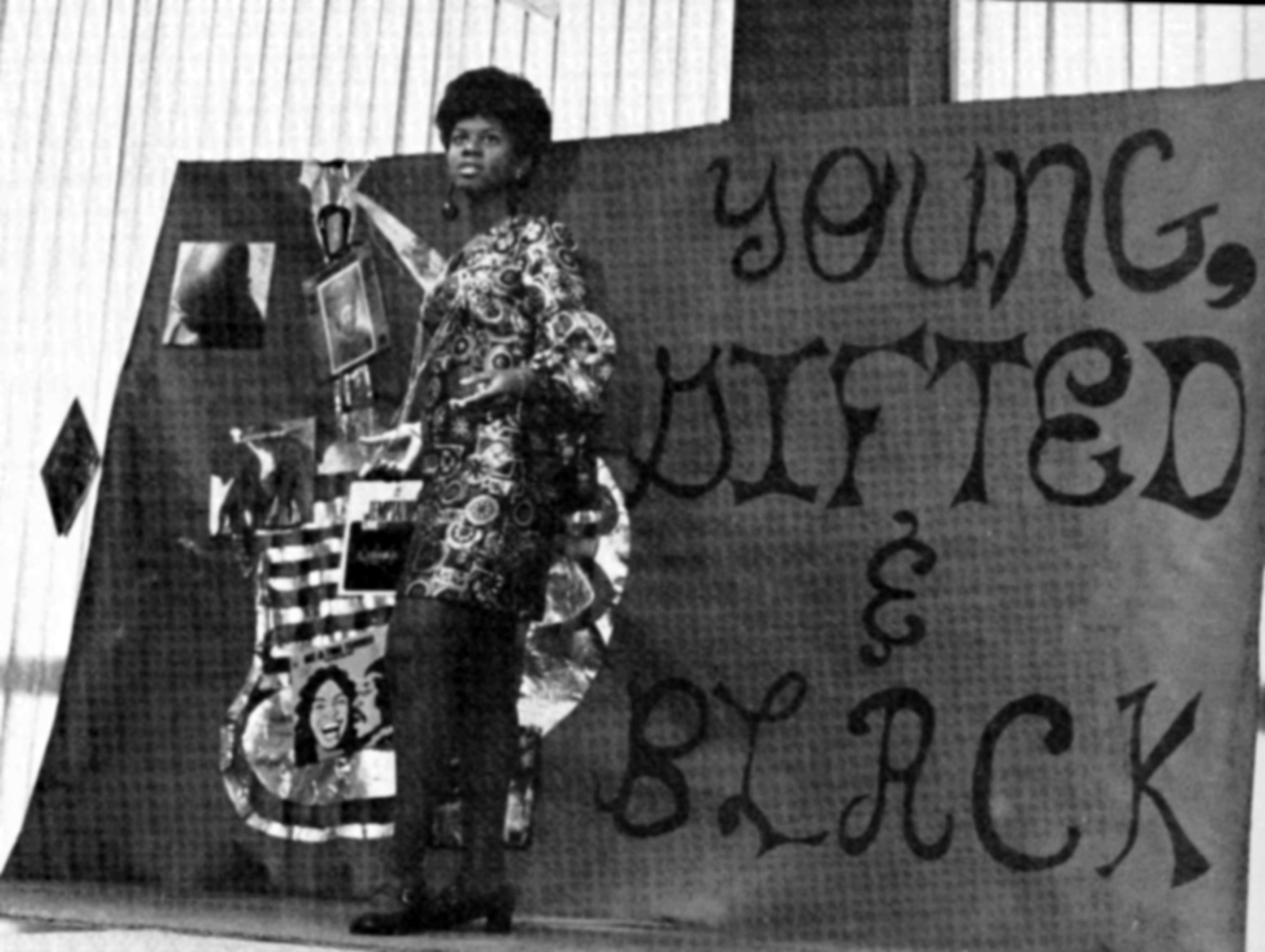 A young Nina Simone, against a poster that reads, young gifted and black, with a colorful dress.