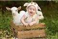 Baby with goats