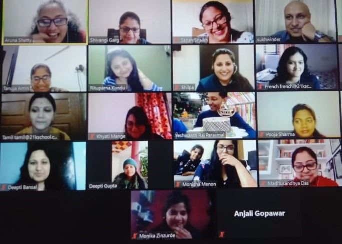Screenshot of various crew who are in an online Zoom meeting with facilitators of 21K School
