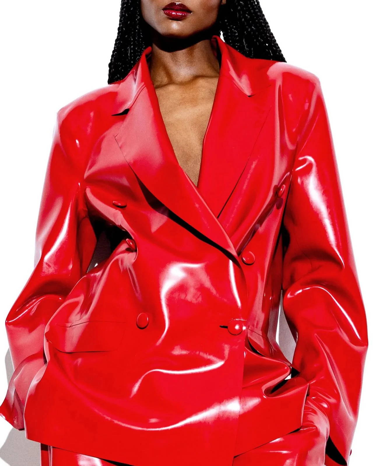 Close-up of Vex Clothing red latex double-breasted blazer with sharp tailoring and high-shine finish.