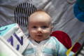 Baby looking at a high-contrast cloth book during tummy time