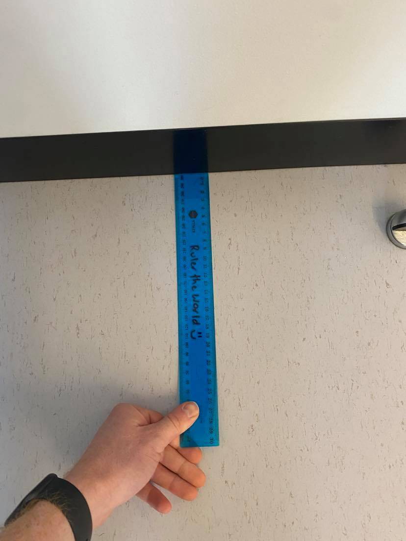 Ruler to measure your knee to wall for calf tightness