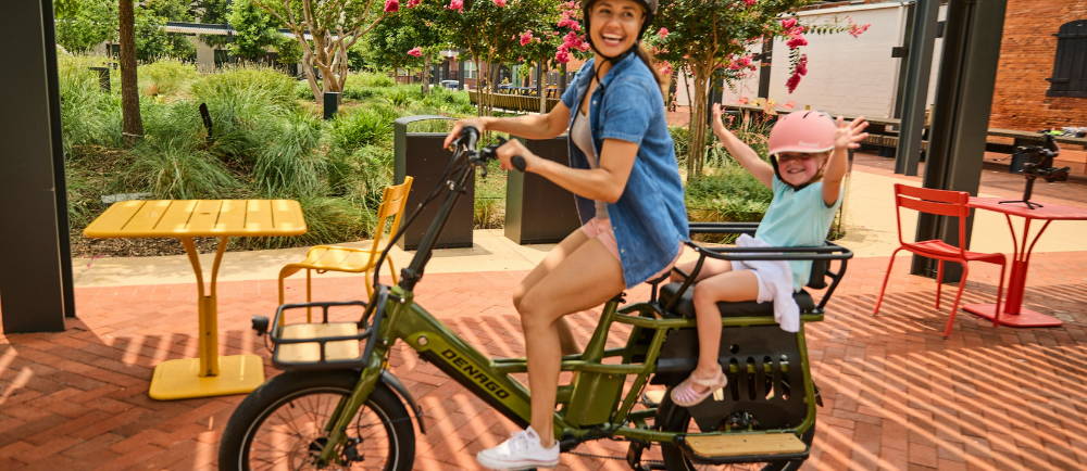 Mom and child on Denago electric cargo bike
