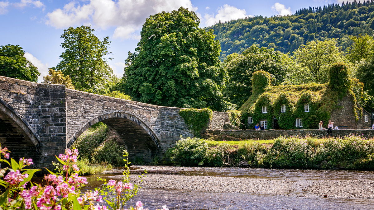 The bridge and river beside Tu Hwnt i'r Bont Tea rooms, River Conwy, Llanwrst, Snowdonia.