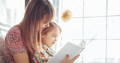 Mother and daughter reading together