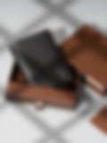 A premium black leather wallet showcased in a branded gift box, highlighting handcrafted quality and elegant design.