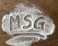 A ground white spice with the letters MSG spelled in it
