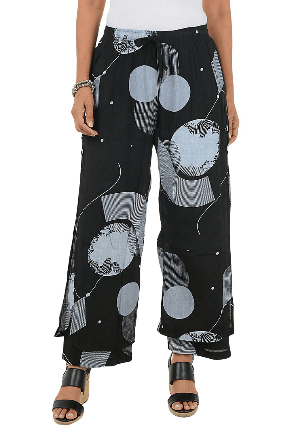 A woman wears a printed wide leg pant