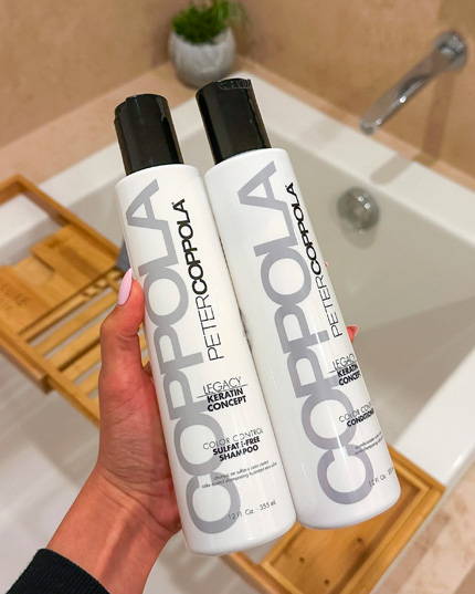 hands holding two bottles. the bottles are 12 ounce color control shampoo and conditioner