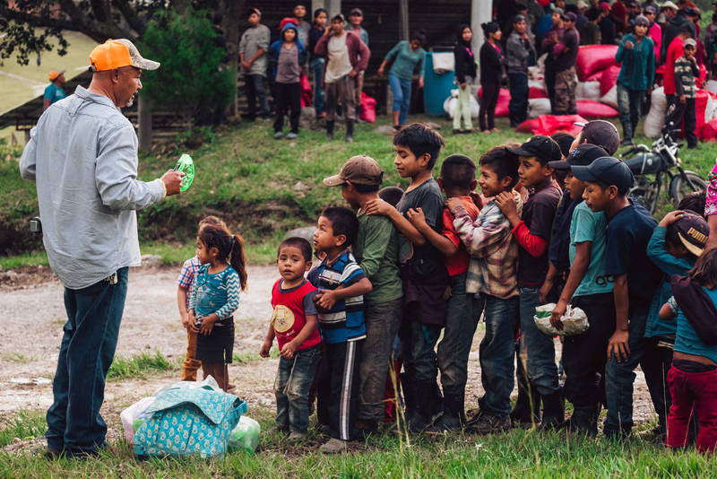 Our CEO, Al Lopez, helping children in Corquin.