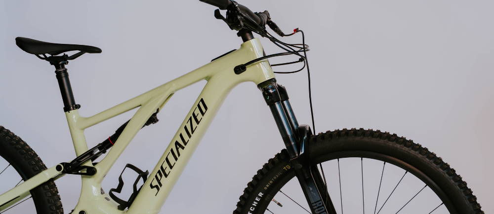 a white Specialized turbo levo electric mountain bike
