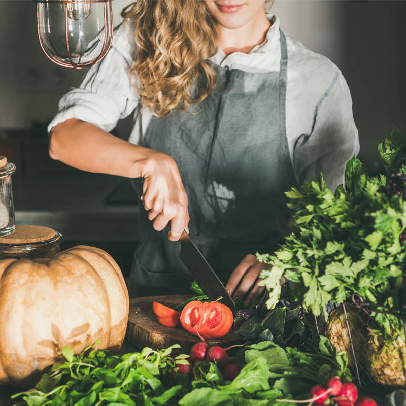 woman cooking with vegetables