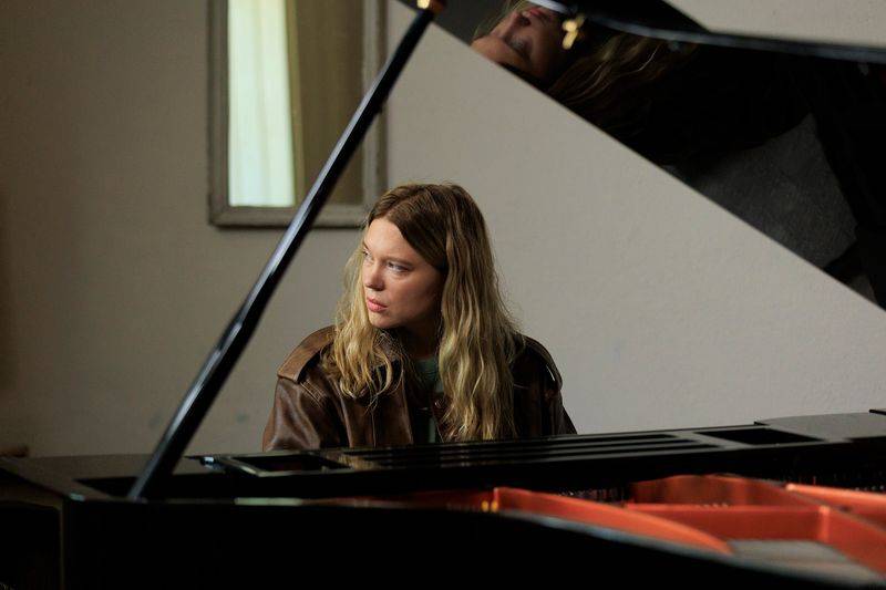 Image may contain: Léa Seydoux, Adult, Person, Musical Instrument, Performer, Leisure Activities, Music, and Musician