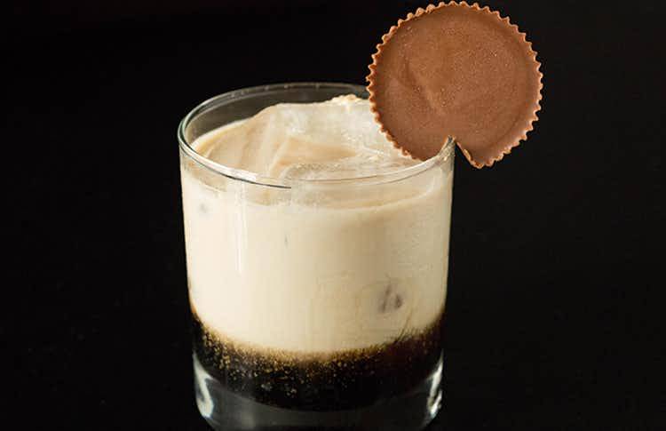 White russian drink with Reece's cup on the rim