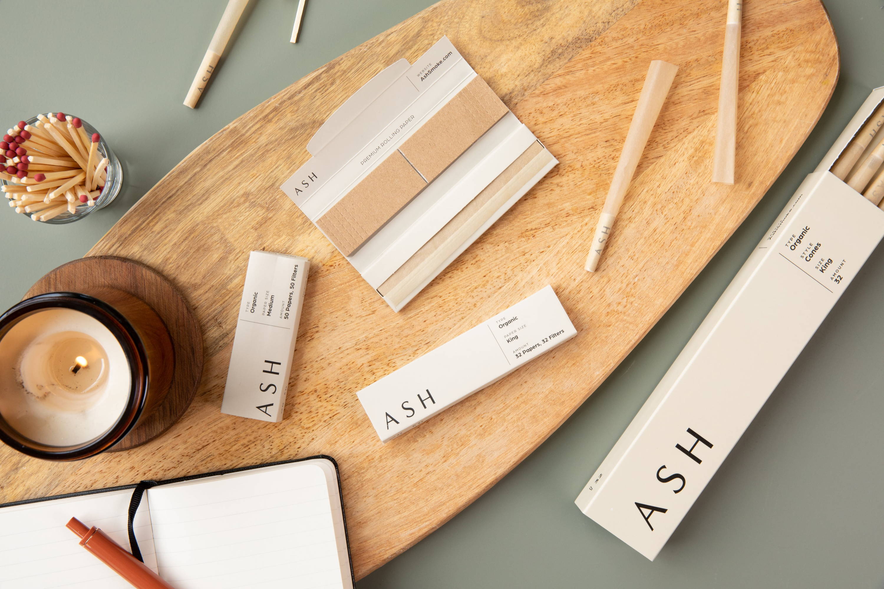 Table picture of ASH rolling collection that says ASH Premium Rolling Papers