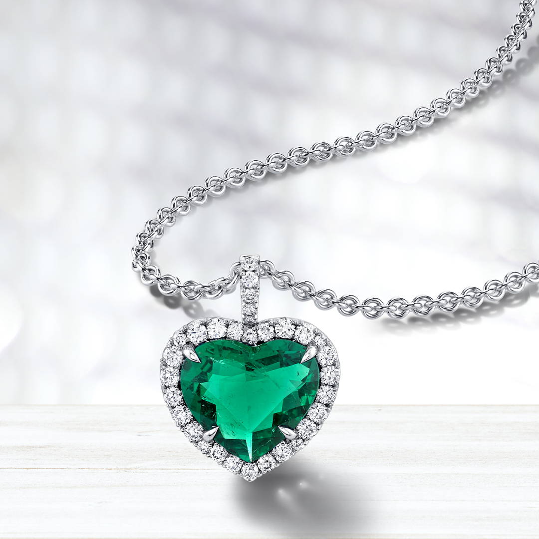heart shaped emerald necklace with diamond halo