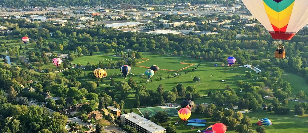 Photo by <a href="https://unsplash.com/@balloonboy8115?utm_source=unsplash&utm_medium=referral&utm_content=creditCopyText">Bryce Boehler</a> on <a href="https://unsplash.com/photos/aerial-view-of-green-grass-field-with-hot-air-balloons-G8puT68YDJs?utm_source=unsplash&utm_medium=referral&utm_content=creditCopyText">Unsplash</a>