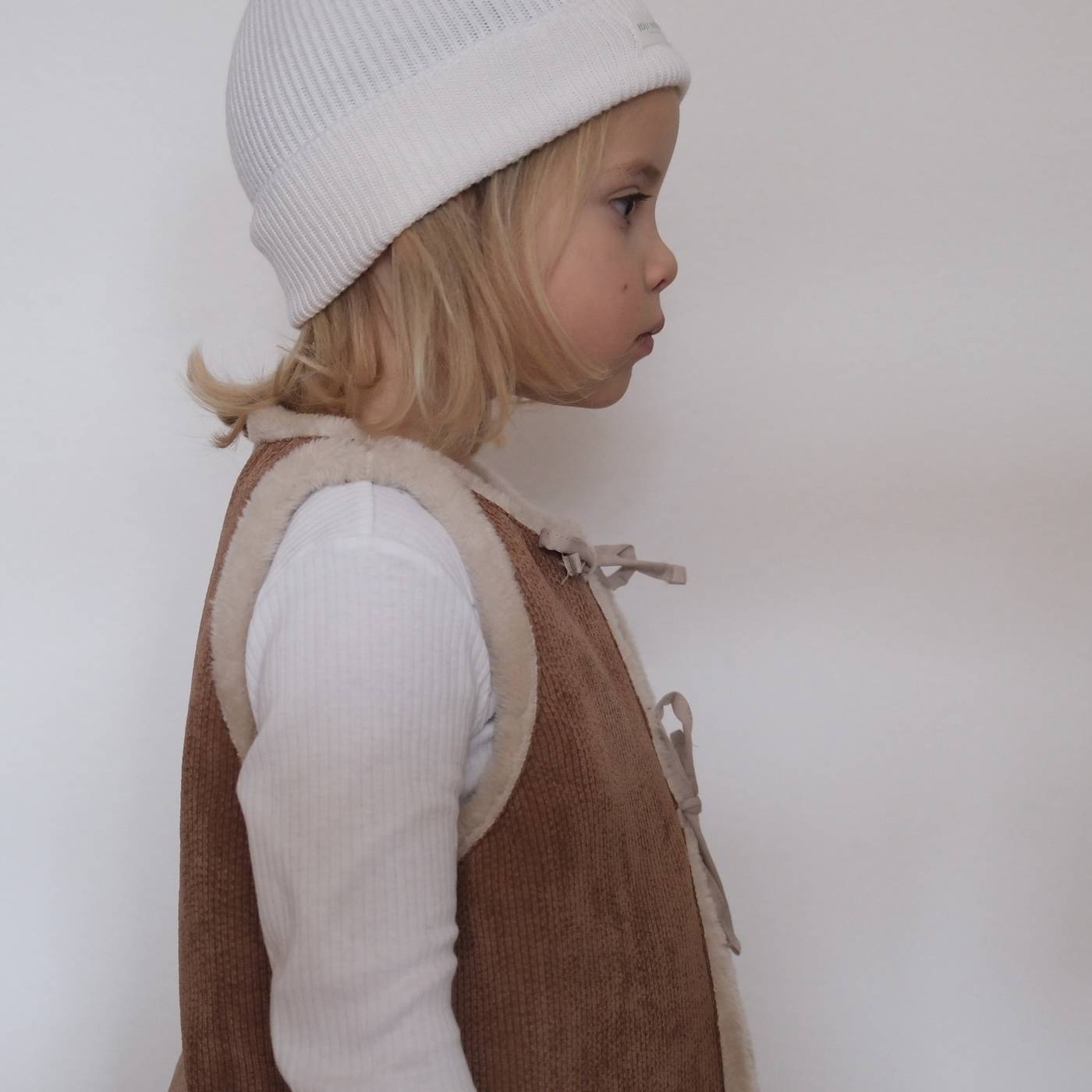 le gilet réversible brun  confort hiver indispensable bébé enfant junior adulte matchy matchy famille suisse excellence qualité élégance cadeau indispensable must-have style qualité excellence premium marque swiss brand kids baby child