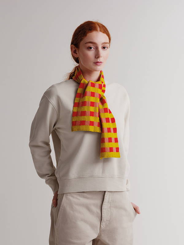 Model wears Small Check And Stripe Scarf Poppy & Plaster