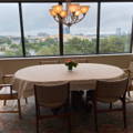 beautiful oval vinyl tablecloth on a dining room with a big window and a great view