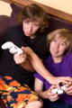 Teenagers playing video games