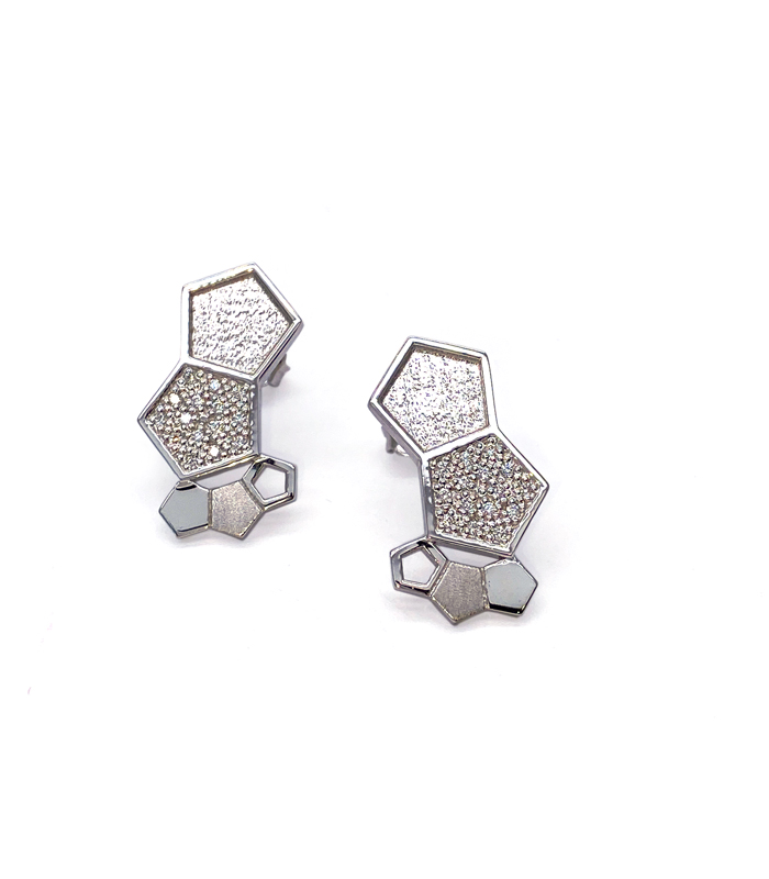 Earrings made of an arrangement of small textured hexagonal shapes of different sizes in white gold 