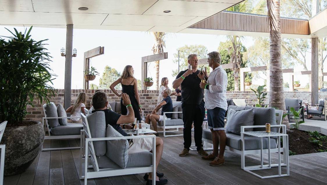 People standing in outdoor area with outdoor setting 