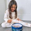 Girl smiling and playing with the Montessori Fishing Game.