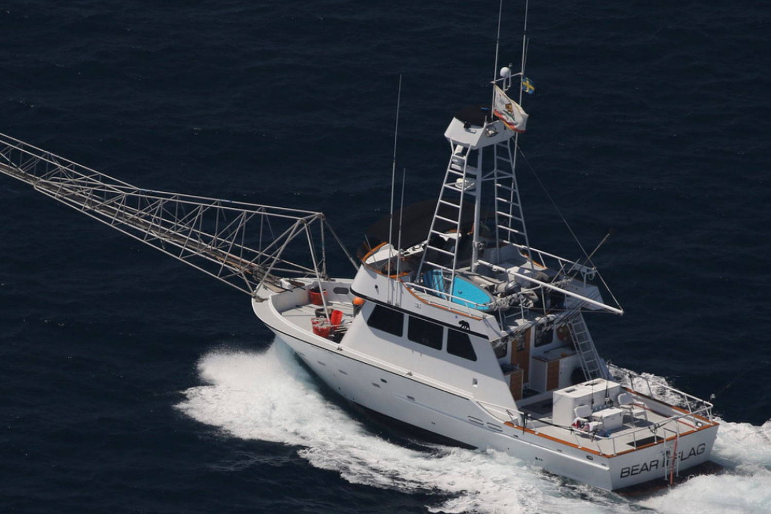 An image of the bear flag boat driving through the harbor.