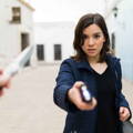 woman_holding_taser_self_defense_weapon