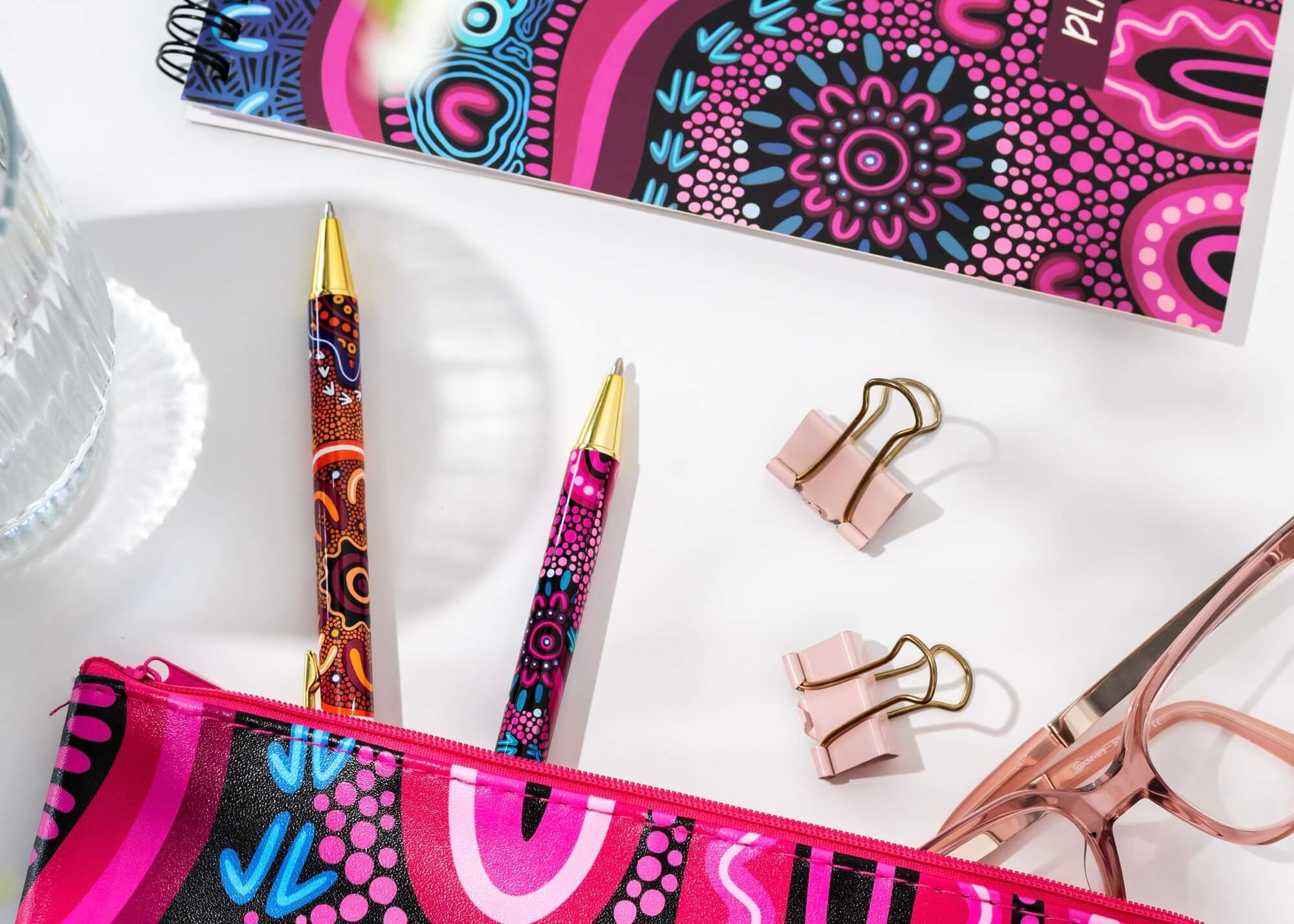pencil case, notepad, and pens in artwork by Amy Kilby 