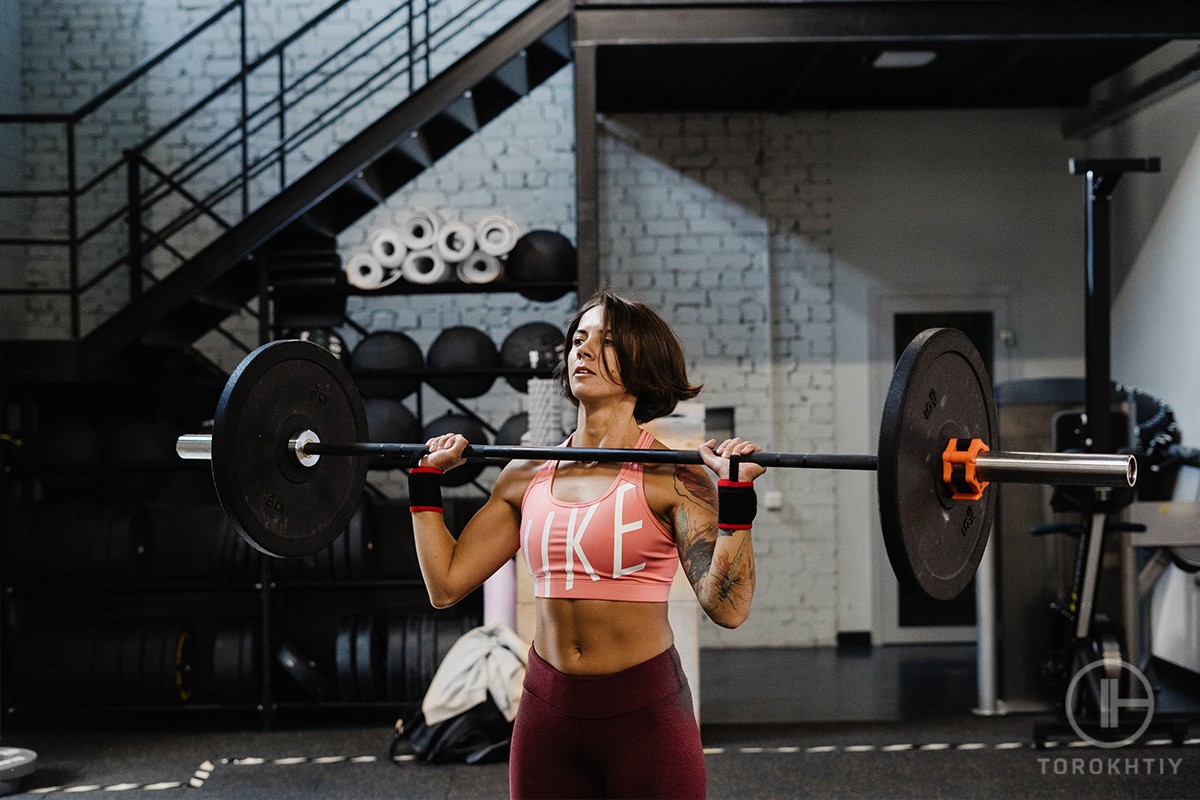 Woman lifting a barbell Woman lifting a barbell