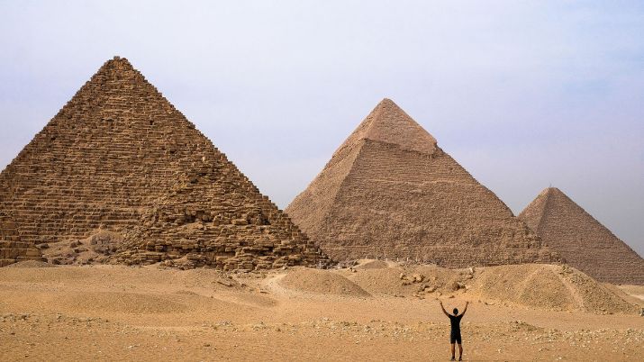 The Pyramids of Giza stand majestically on the edge of the Egyptian desert