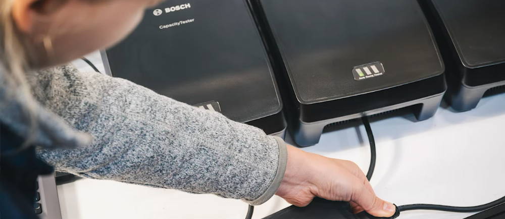Technician testing Bosch e-bike batteries