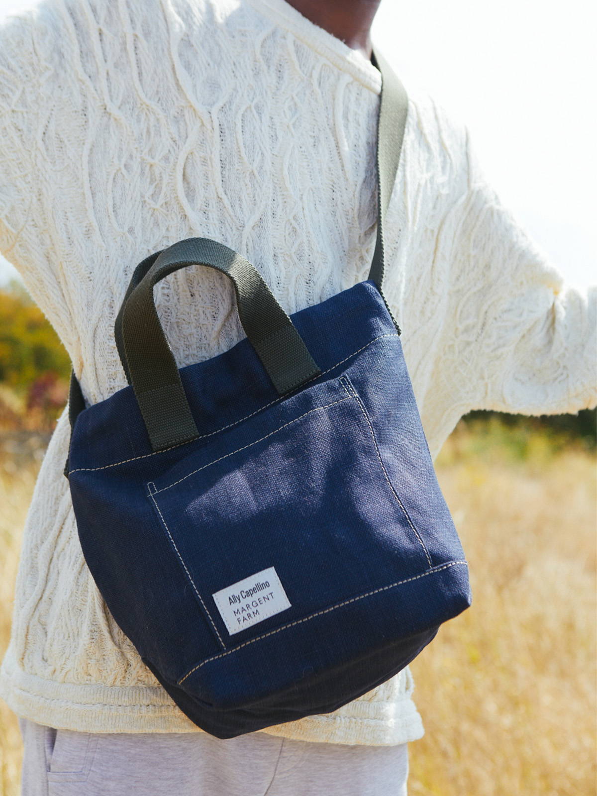 Ally Capellino X Margent Farm Bobby Hemp Bucket Bag on model in Navy