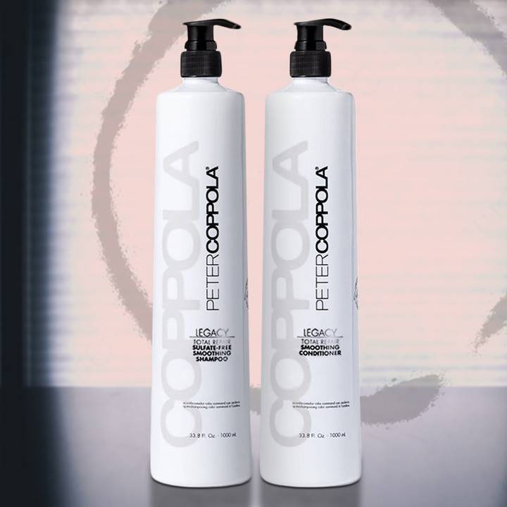 two bottles side by side. 33.8 ounce bottles of total repair shampoo and conditioner