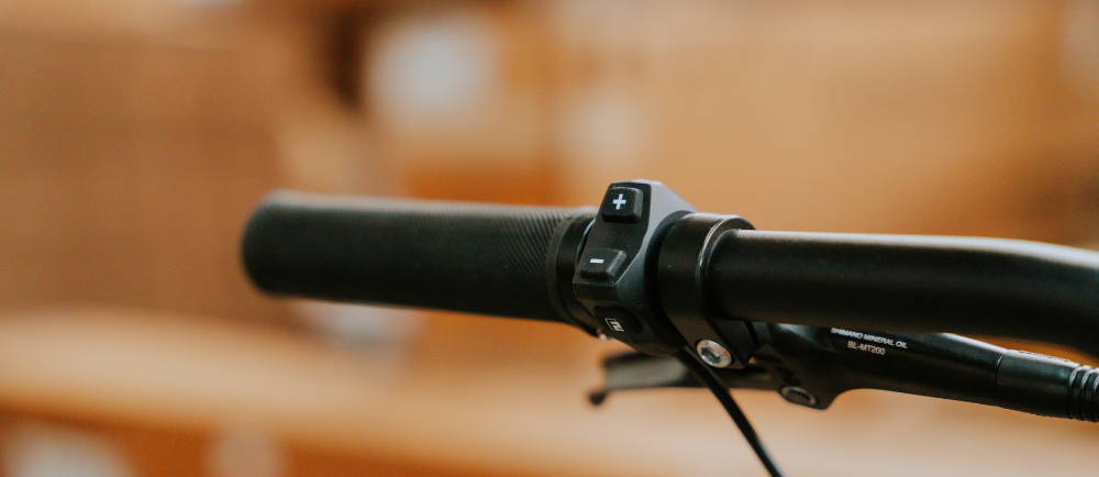 Close up of electric bike handlebars and controller