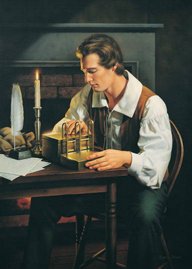Jesus Smith sitting at a desk translating the gold plates.