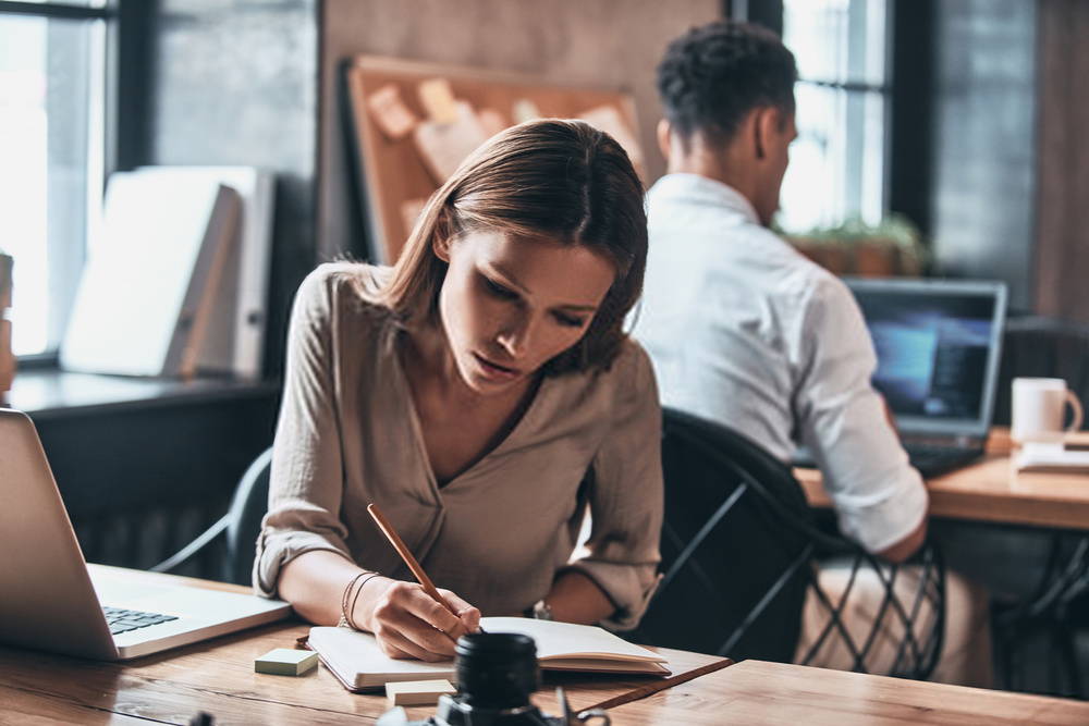 Woman concentrating at work desk