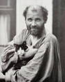 Gustav Klimt in his Painter's Smock with a Cat