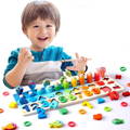 Little boy enjoying his time playing with the Montessori Smart Board.
