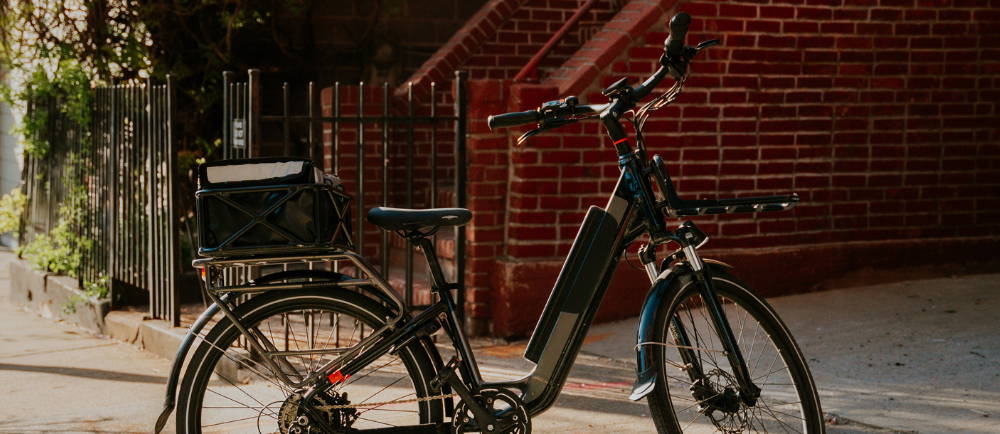 A black Rad Power RadRover electric city bike in a city