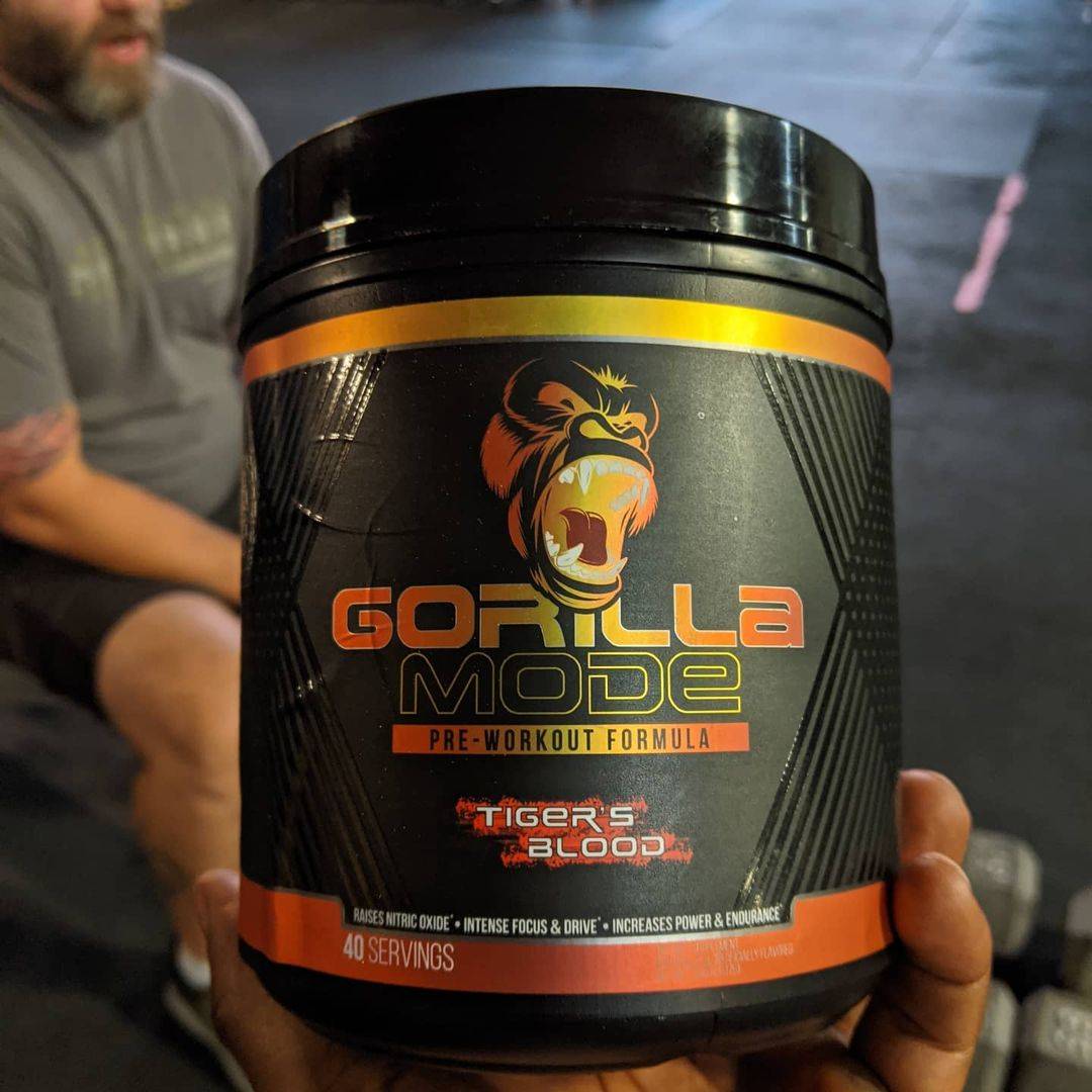 gorilla mode pre workout supplement in hand