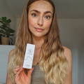 Photo of women holding wavy hair oil