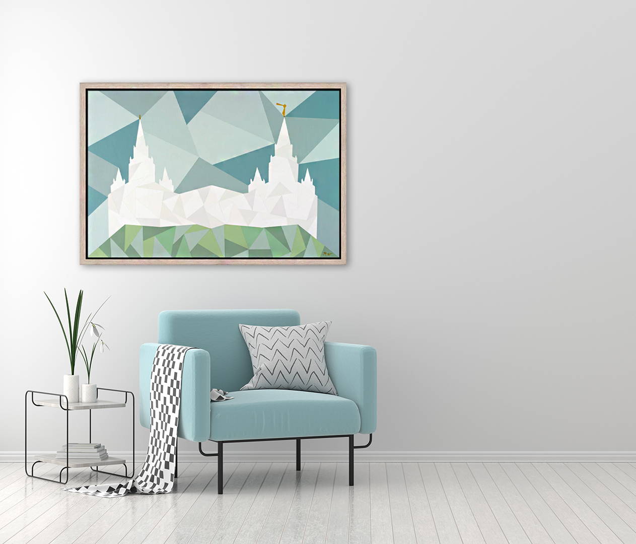 Geometric painting of Las Vegas Temple hanging above a sitting chair.